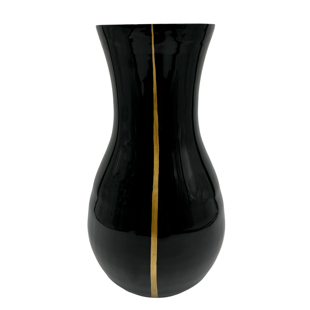 Black vase with a gold stripe on a white background