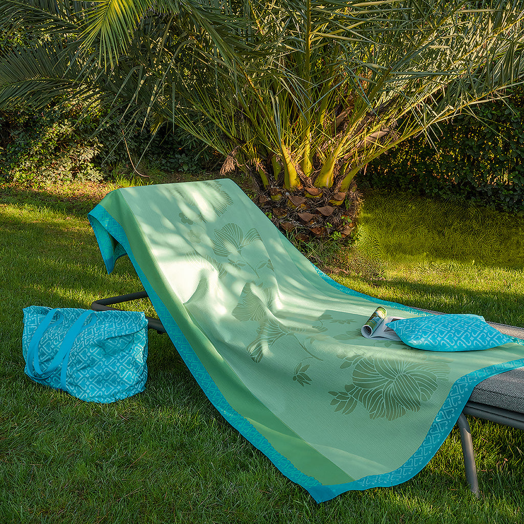 Monoi Blue Beach Towel - shown draped on a lounger