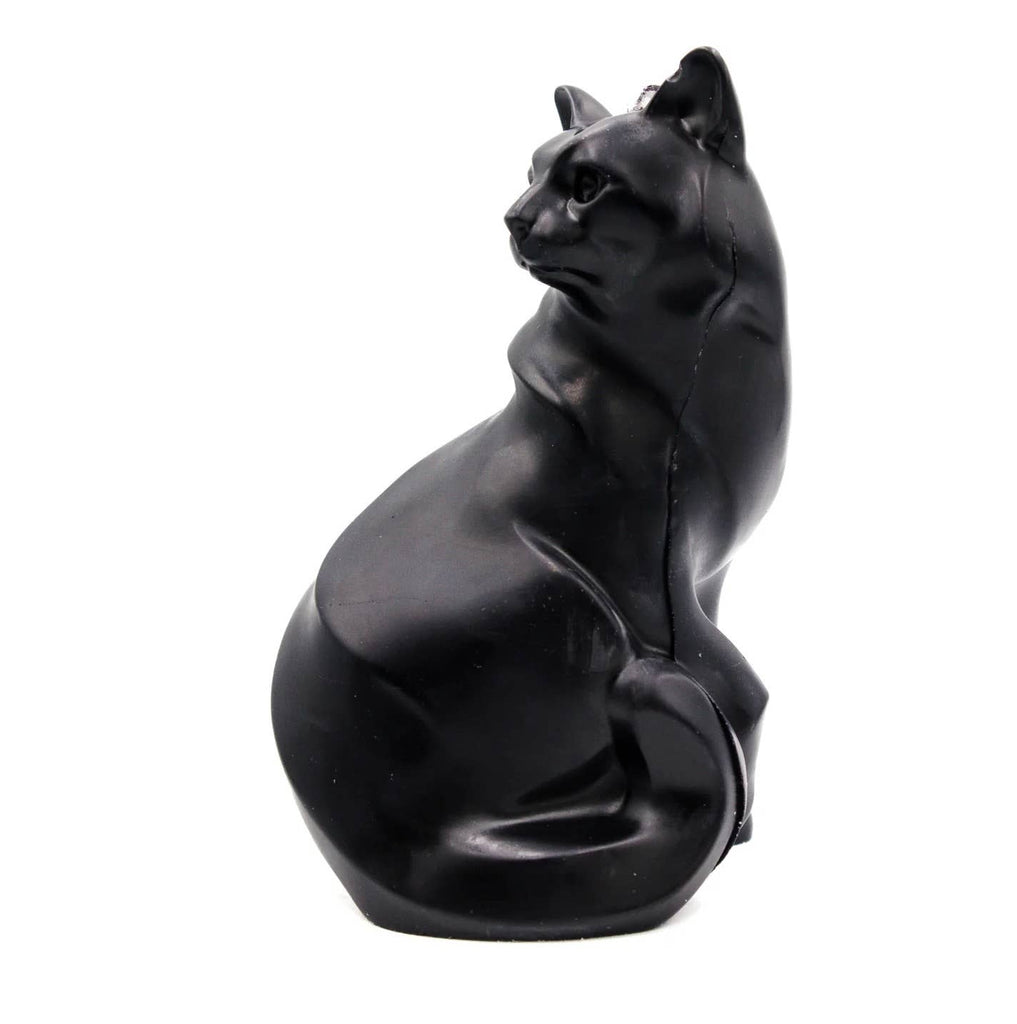 Black cat-shaped candle on a white background