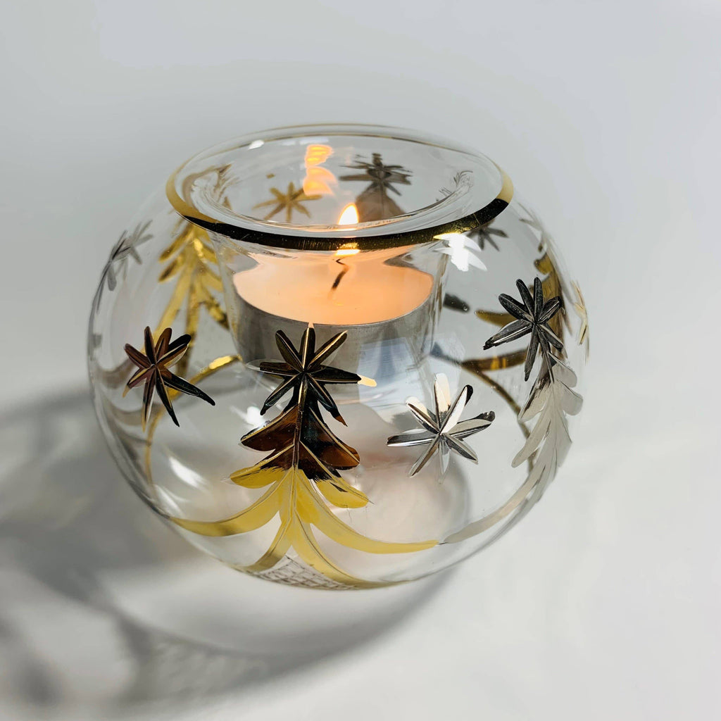 Decorative clear glass candle holder with gold tree designs 