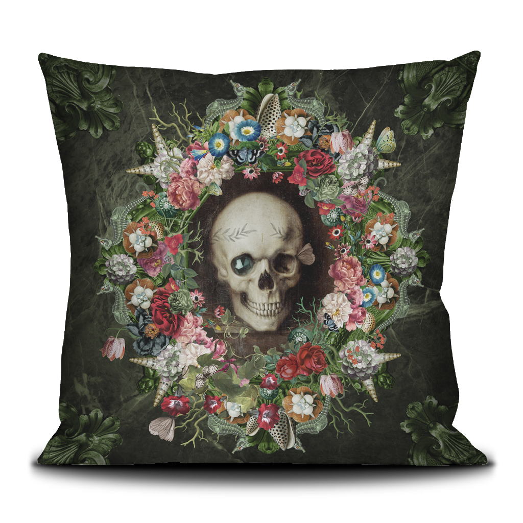 Decorative pillow with a skull and floral wreath design on a dark background