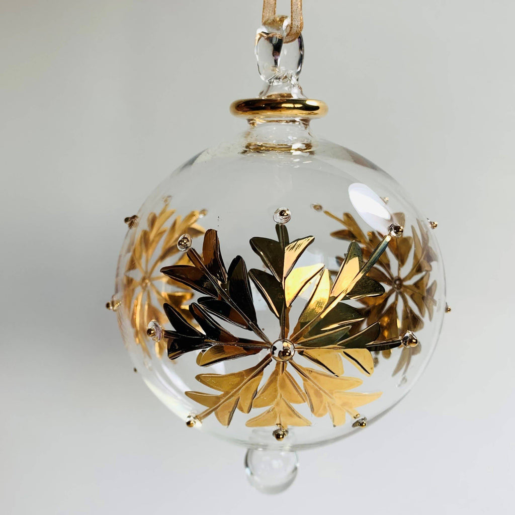 Clear glass ornament with gold leaf design 