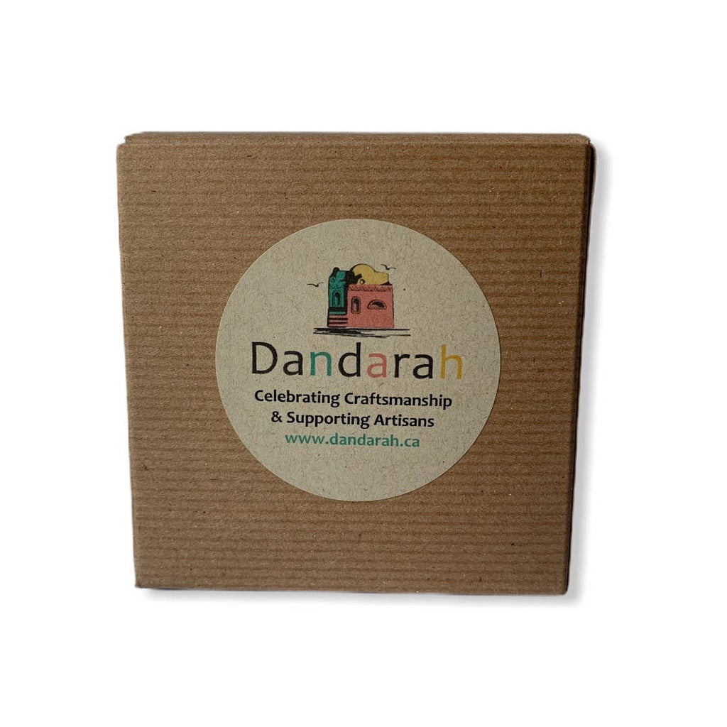A brown cardboard box with a Dandarah label could be used as a gift wrapping  