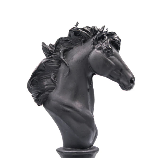 Black horse head candle on a white background