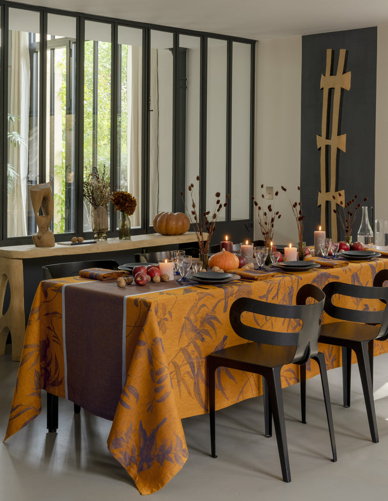 Voliere Blue Orange Tablecloth with Fall theme table setting  pumpkins and fruit 