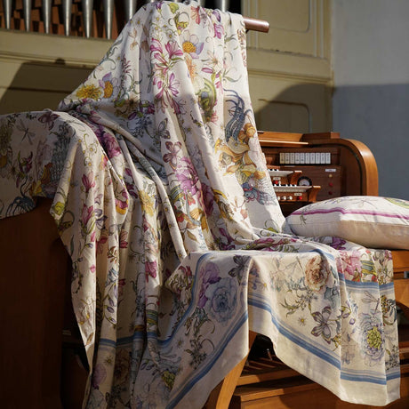 Floral throw draped over organ keyboard