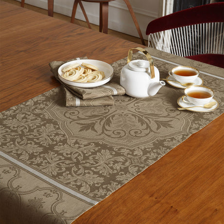 Armoiries Brown 20" x 59" Runner on a table with a tea set on top 